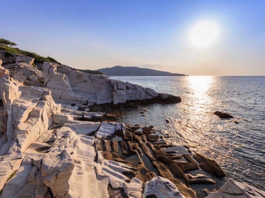 Aegean seashore and marble rocks in Aliki, Thassos island, Greece